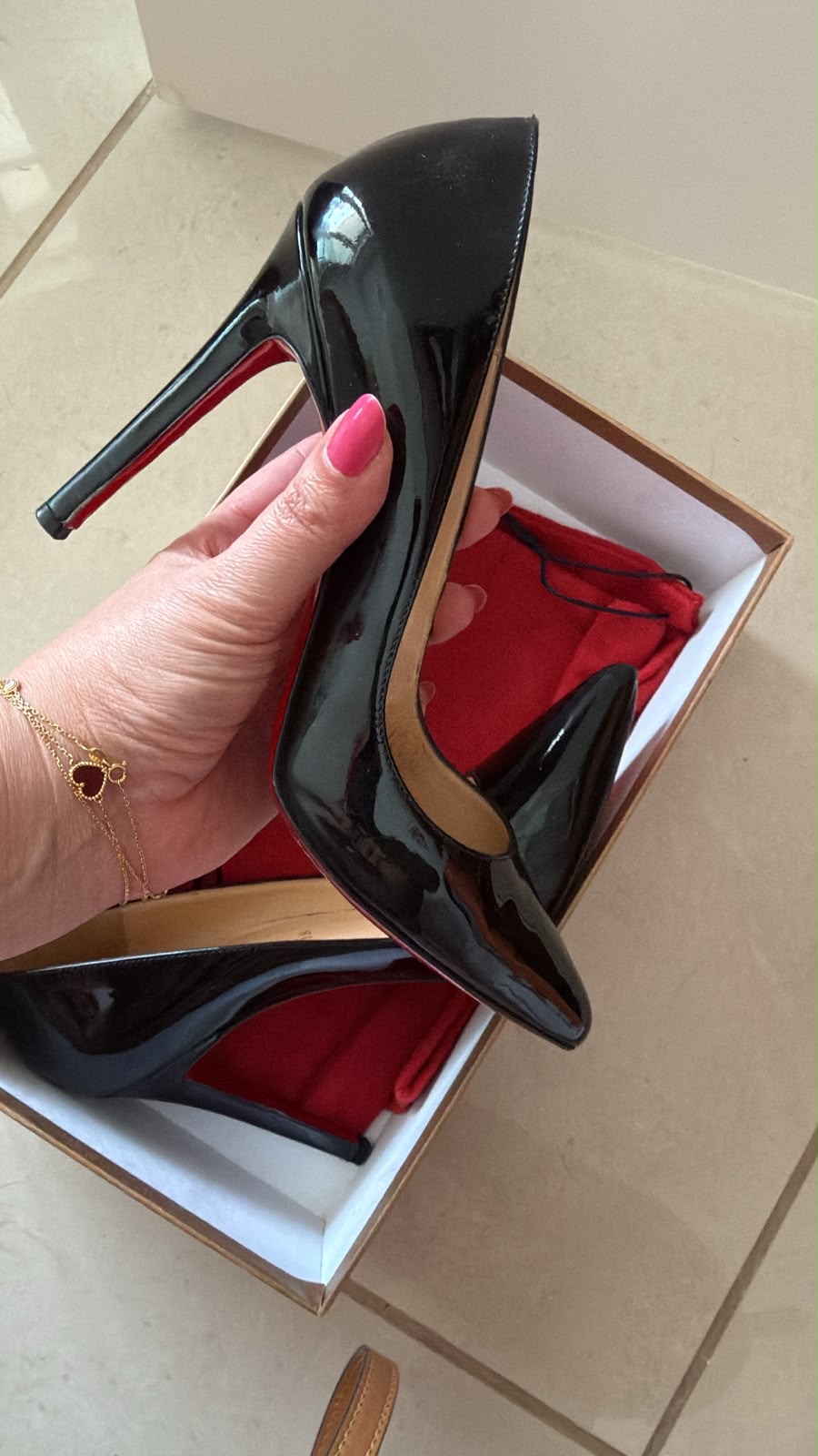 Christian Louboutin Pigalle 100 — Black patent calf leather, signature red sole