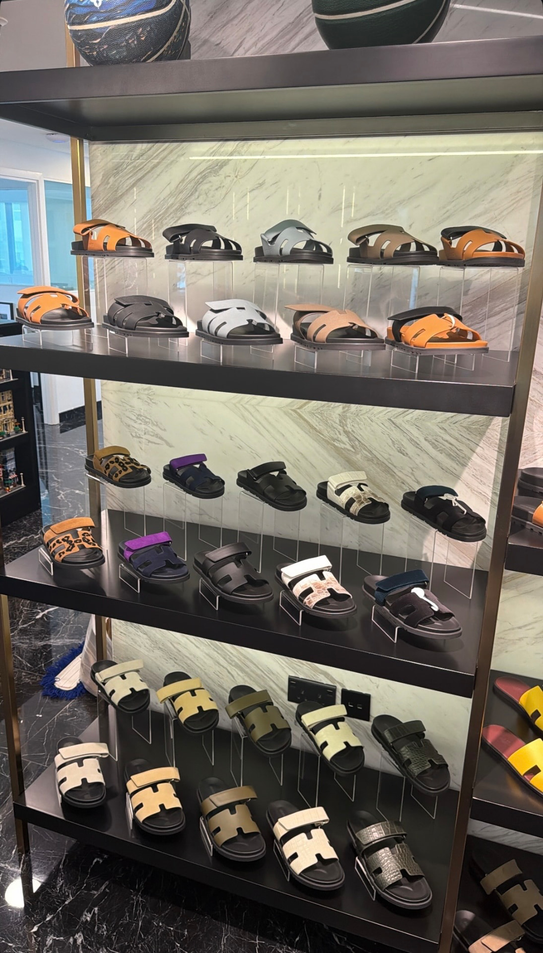 Shelves of authenticated pre-owned designer shoes inside The Shoe Salon